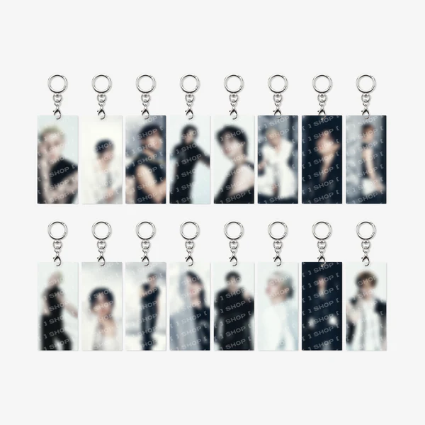 Twelve rectangular acrylic keychains with silver key rings, arranged in two rows of six on a light gray background. Each keychain features a blurred portrait photo of a male idol with repeated 'STAYCUT' watermark text.
